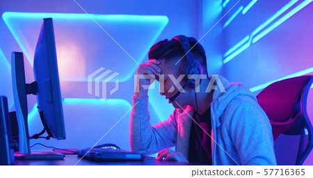 Young Asian cyber sport gamer 57716365