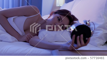 woman insomnia on bed 57716481