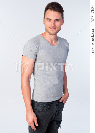Studio shot of happy handsome man with casual clothing smiling 57717623