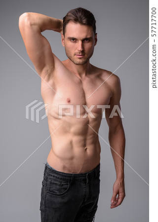 Studio shot of handsome muscular man shirtless 57717700
