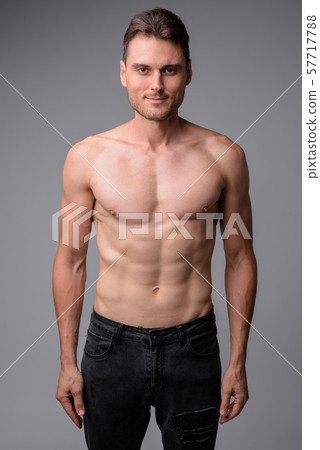 Studio shot of handsome muscular man shirtless Studio shot of handsome muscular man shirtless 57717788