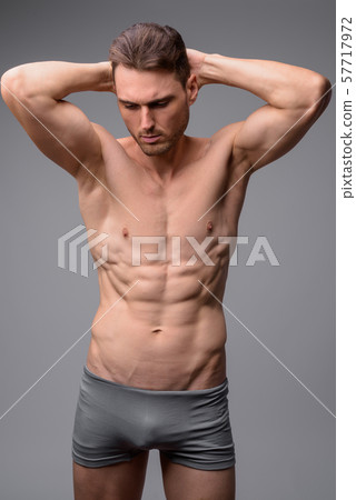 Studio shot of handsome muscular man shirtless 57717972