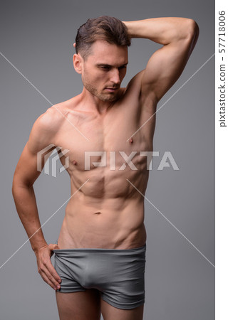 Studio shot of handsome muscular man shirtless Studio shot of handsome muscular man shirtless 57718006