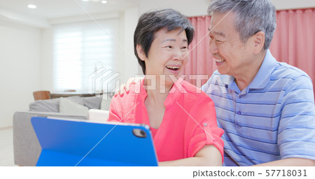 elderly couple use digital tablet elderly couple use digital tablet 57718031