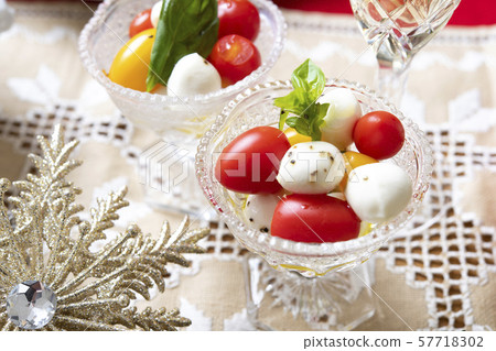 Caprese of tomato and mozzarella cheese Caprese of tomato and mozzarella cheese 57718302