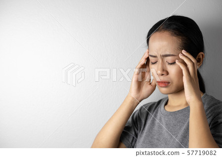 Young woman with of stress and headaches. Young woman with of stress and headaches. 57719082