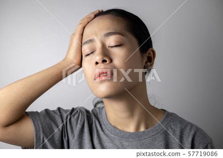 Young woman with of stress and headaches. Young woman with of stress and headaches. 57719086