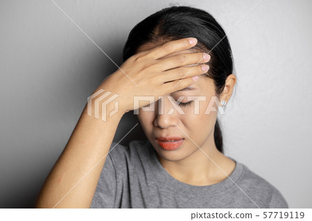 Young woman with of stress and headaches. Young woman with of stress and headaches. 57719119