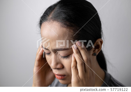Young woman with of stress and headaches. Young woman with of stress and headaches. 57719122