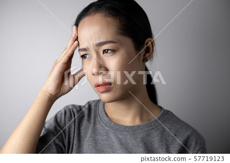 Young woman with of stress and headaches. Young woman with of stress and headaches. 57719123