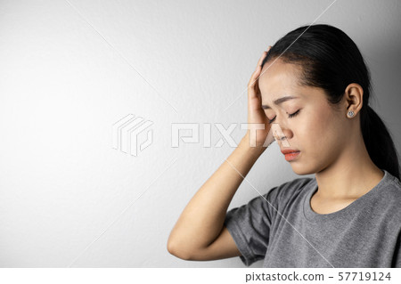 Young woman with of stress and headaches. Young woman with of stress and headaches. 57719124