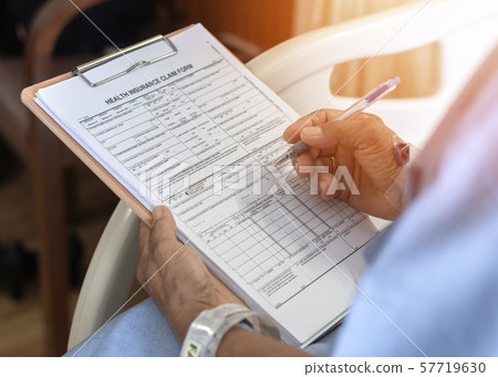 Health insurance claim form application for medicare coverage and medical treatment for patient with illness, accident injury and admitted in hospital ward 57719630
