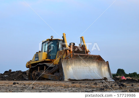 Track-type bulldozer, earth-moving equipment. Land clearing, grading, pool excavation,  57719986