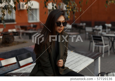 A young and beautiful fashionable brunette woman 57720136