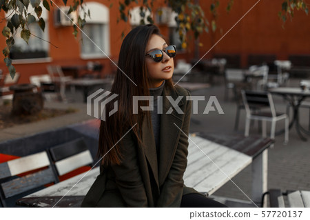 Attractive girl in stylish black sunglasses  57720137