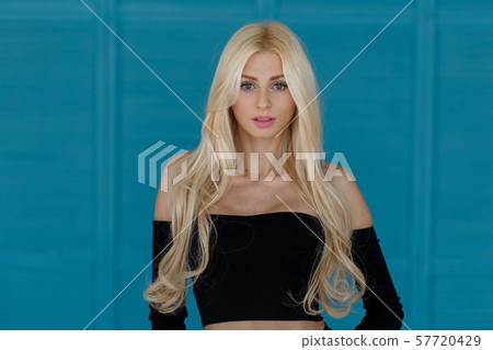Beautiful young stylish blond woman with long hair Beautiful young stylish blond woman with long hair 57720429