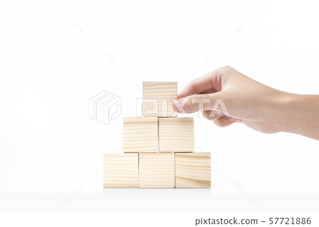 Hand build a pyramid from a wooden block Hand build a pyramid from a wooden block 57721886