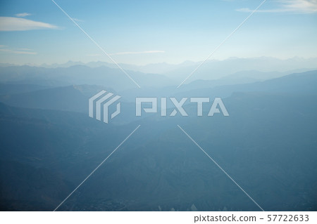 Picture of foggy mountain area at sunset 57722633