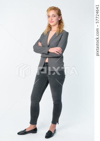 Full body shot of beautiful blonde businesswoman with arms crossed 57724641