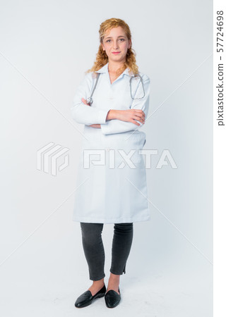 Full body shot of beautiful blonde woman doctor with arms crossed 57724698