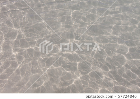 Clear water surface with white sand. 57724846