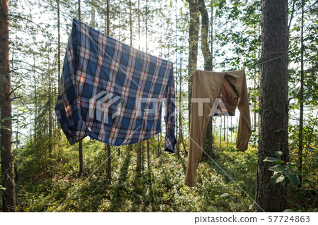 fresh clean clothess drying on washing line in outdoor 57724863