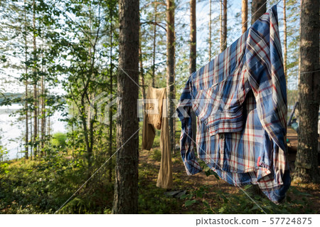 fresh clean clothess drying on washing line in outdoor 57724875