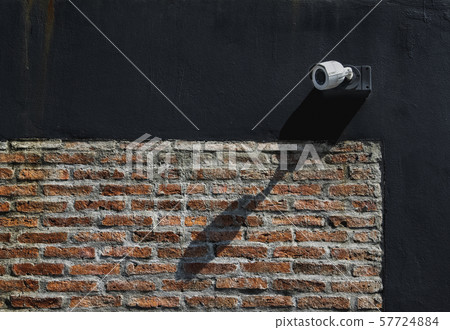CCTV security camera on exterior wall at home office for surveillance security monitoring home guard 57724884