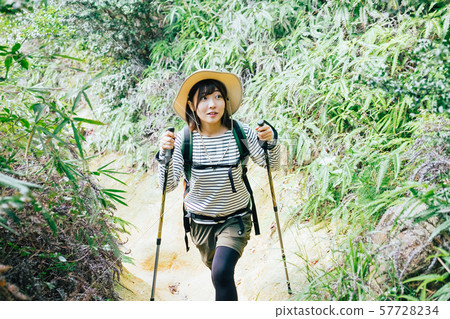 A young woman climbing 57728234