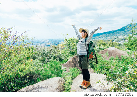 A young woman climbing 57728292