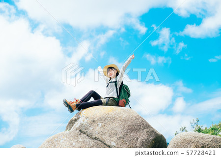 Young woman climbing 57728421