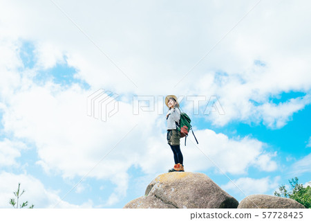 Young woman climbing 57728425