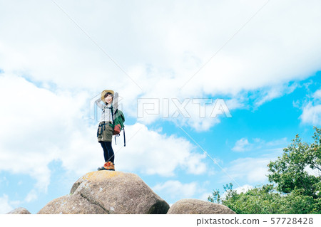 Young woman climbing 57728428