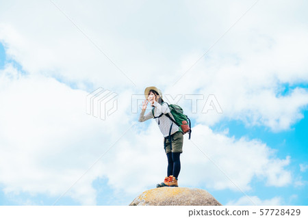 Young woman climbing 57728429