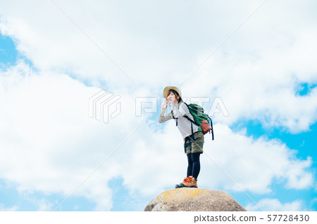 Young woman climbing 57728430