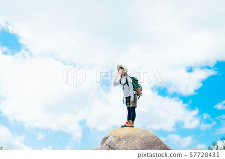 Young woman climbing 57728431