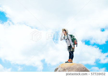 Young woman climbing 57728432