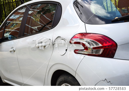 A car with a scratch on the body. Close-up 57728583