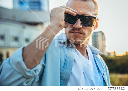 Young caucasian man, modern shot in film grain effect Young caucasian man, modern shot in film grain effect 57728882