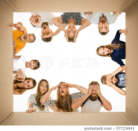 Shocked people opening the biggest postal package 57729041