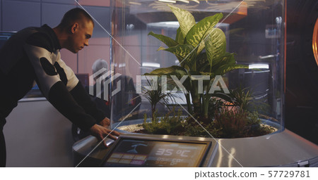 Scientists and robot working in lab 57729781