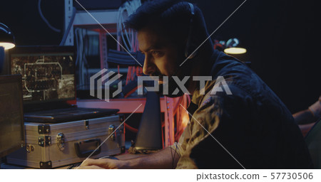 Soldier following car movement on computer Soldier following car movement on computer 57730506