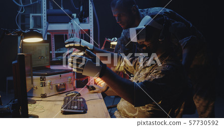 Soldier using VR headset and gloves Soldier using VR headset and gloves 57730592