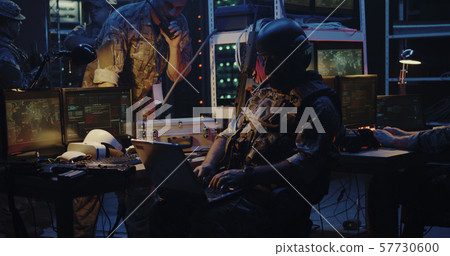 Soldier working on a laptop Soldier working on a laptop 57730600