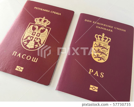 Serbian and Danish Passports on the white background Serbian and Danish Passports on the white background 57730735