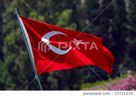 red flag of Turkey waving n street on a green background 57731210