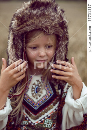 girl Indian shaman blonde in a poncho 57731317