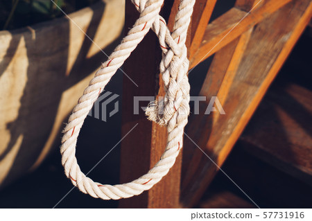The old white rope was tied in a circle. The old white rope was tied in a circle. 57731916