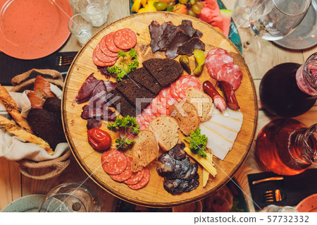 Italian antipasti wine snacks set. Brushettas, cheese variety, Mediterranean olives, pickles Italian antipasti wine snacks set. Brushettas, cheese variety, Mediterranean olives, pickles 57732332