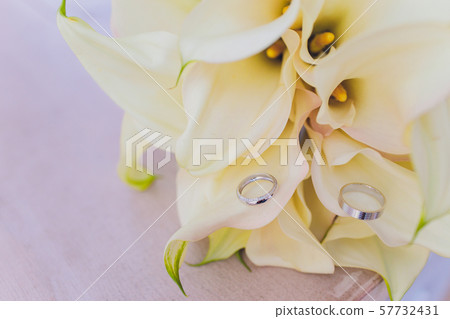 Bouquets of flowers on the floor in front of a flower shop with lilies, sunflowers, carnations 57732431